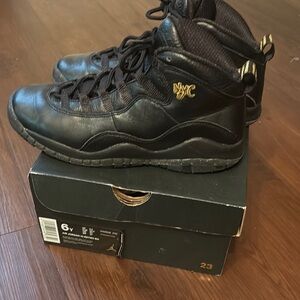 Black and Gold High-Top Jordan Sneakers